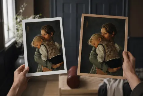 An art print and a framed portrait on display